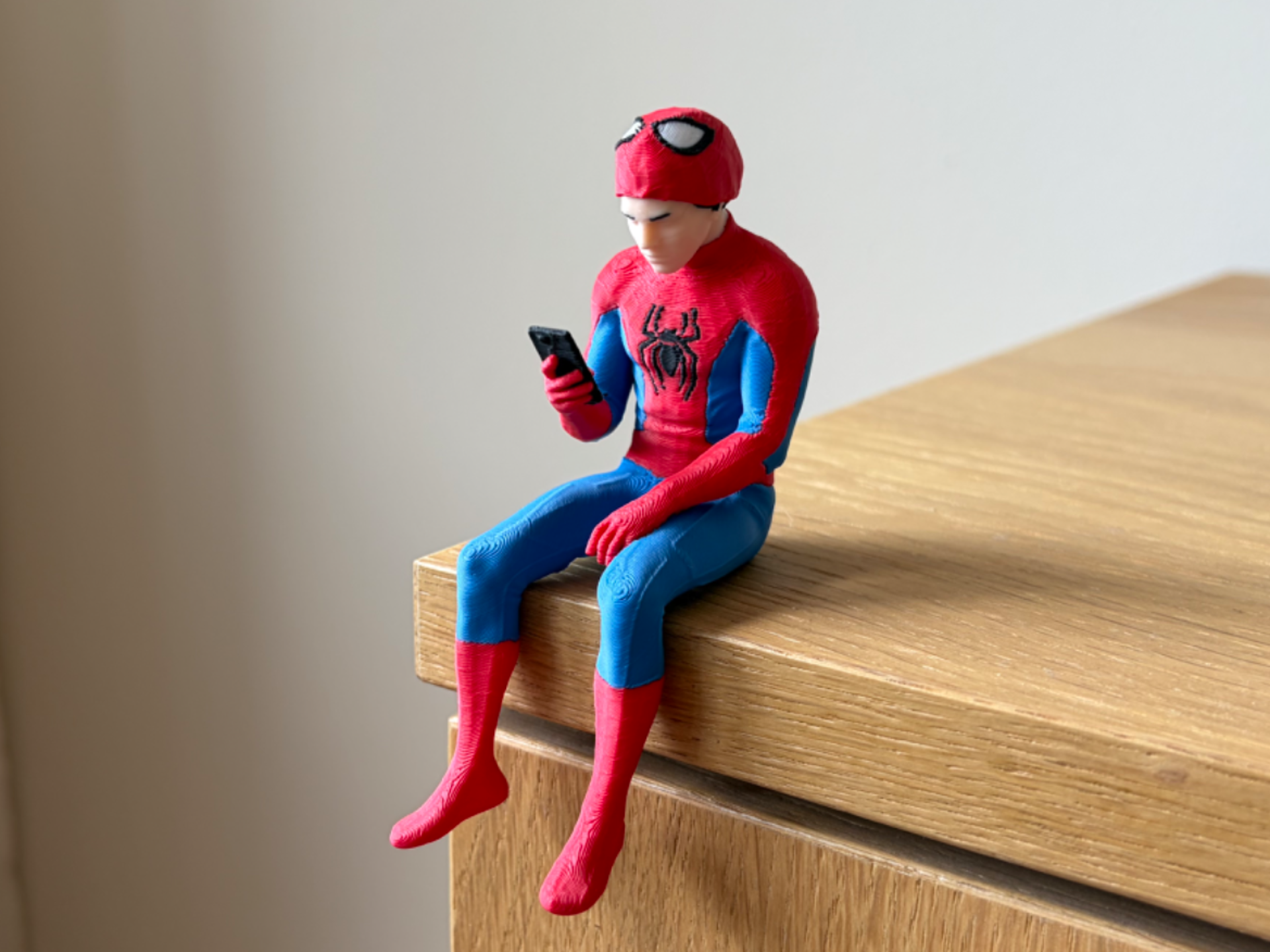 Peter Parker Sitting on Shelf Figure | Spider-Man