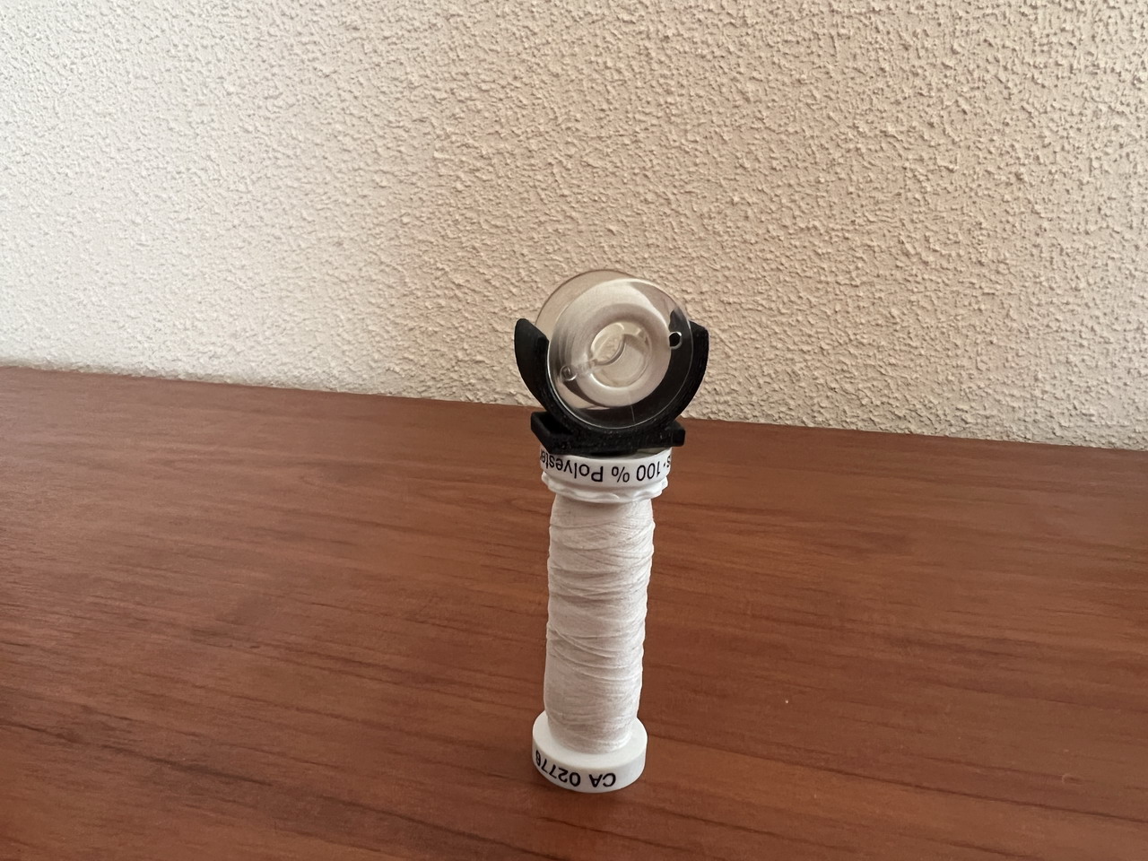 Sewing machine bobbin clip