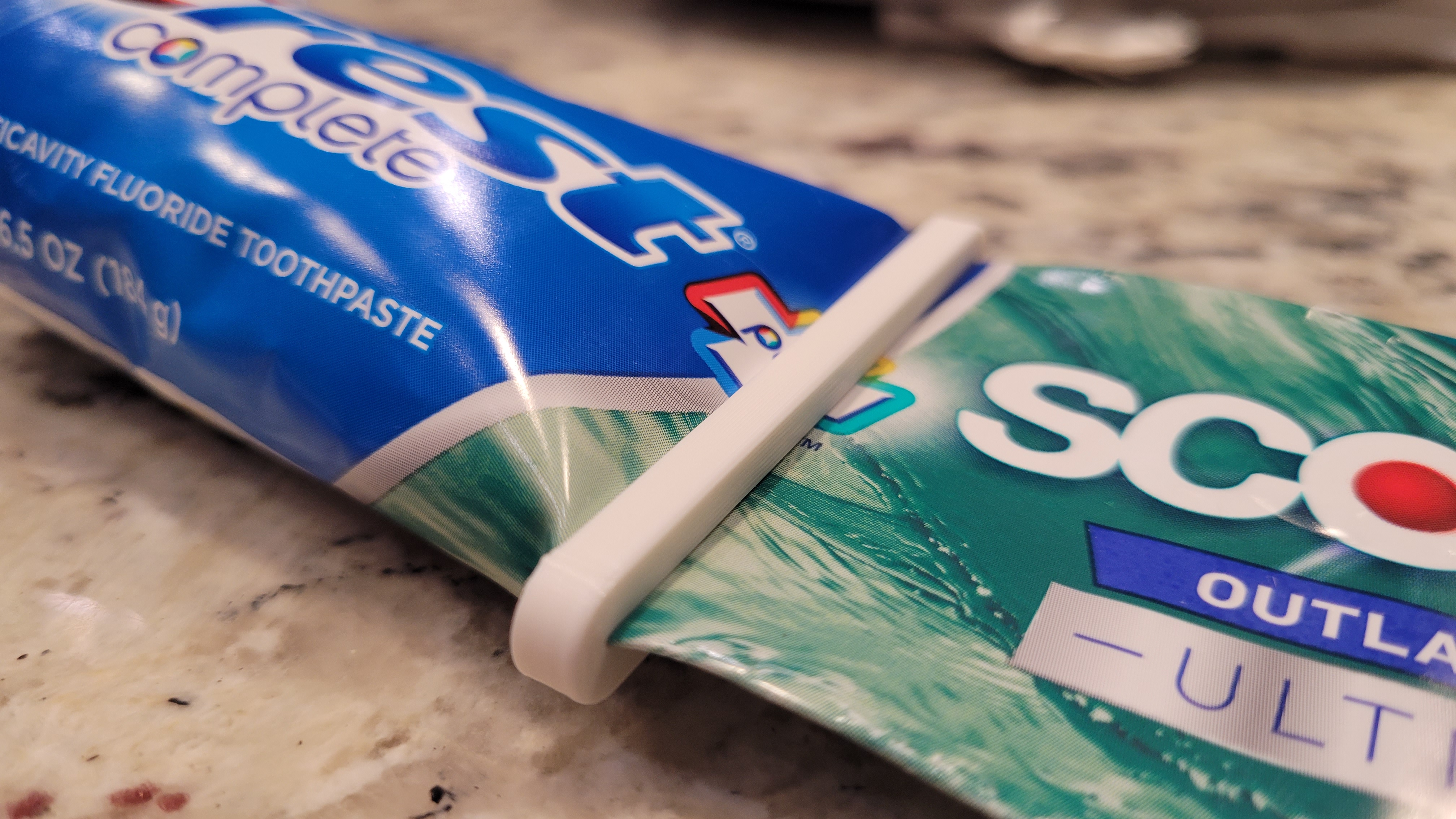 Minimalist toothpaste squeezer / paste pusher