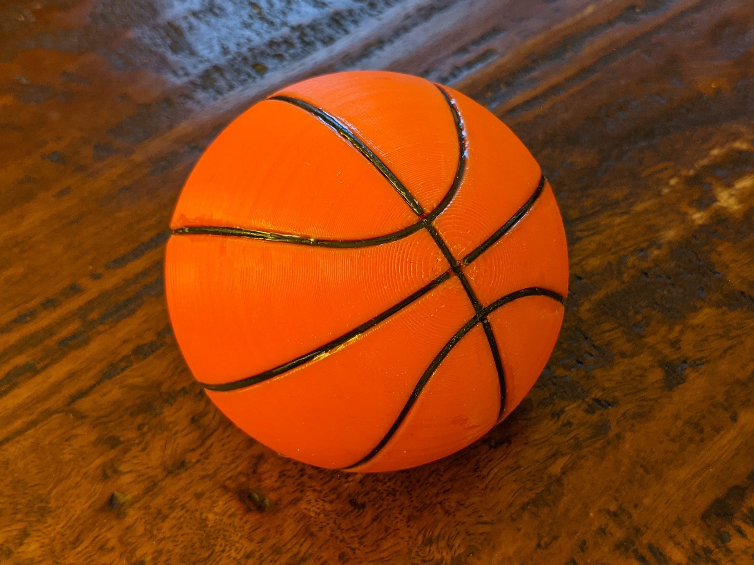 Basketball with inset filament