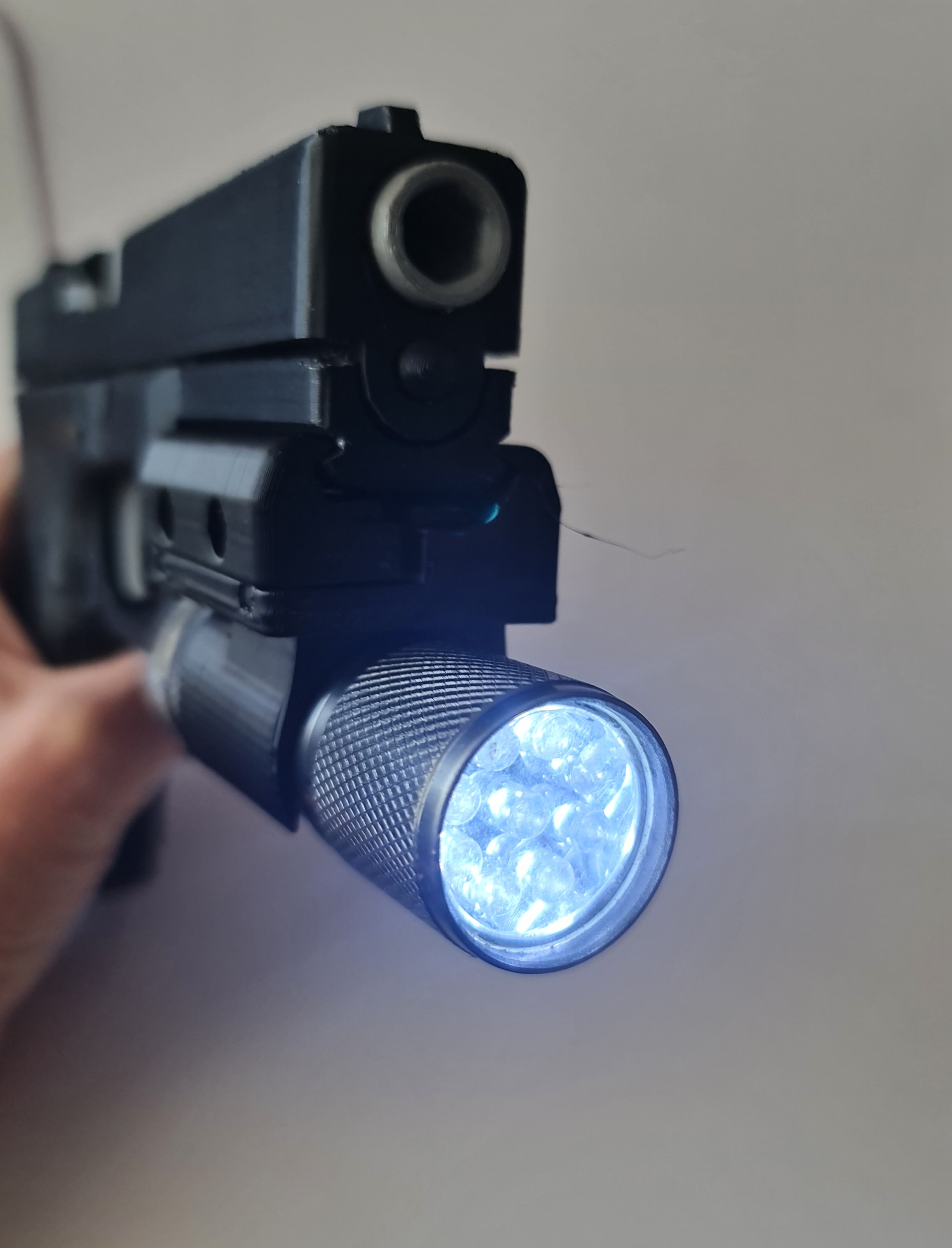 Rail attachment for 9mm pistol