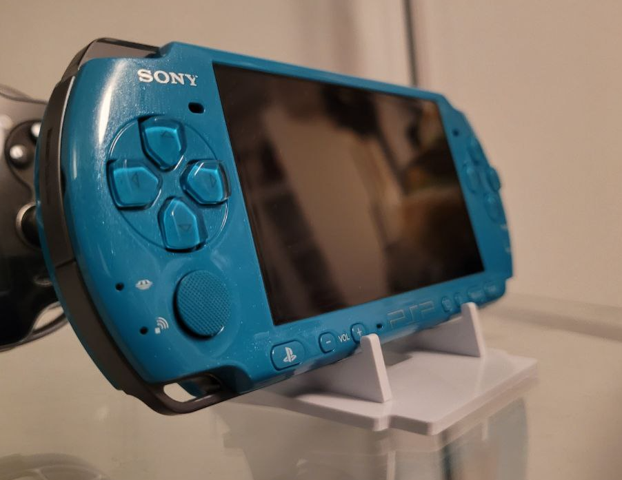 Universal stand for handheld consoles PSP, Vita, DS, DSi, WonderSwan, CD, DVD, ...