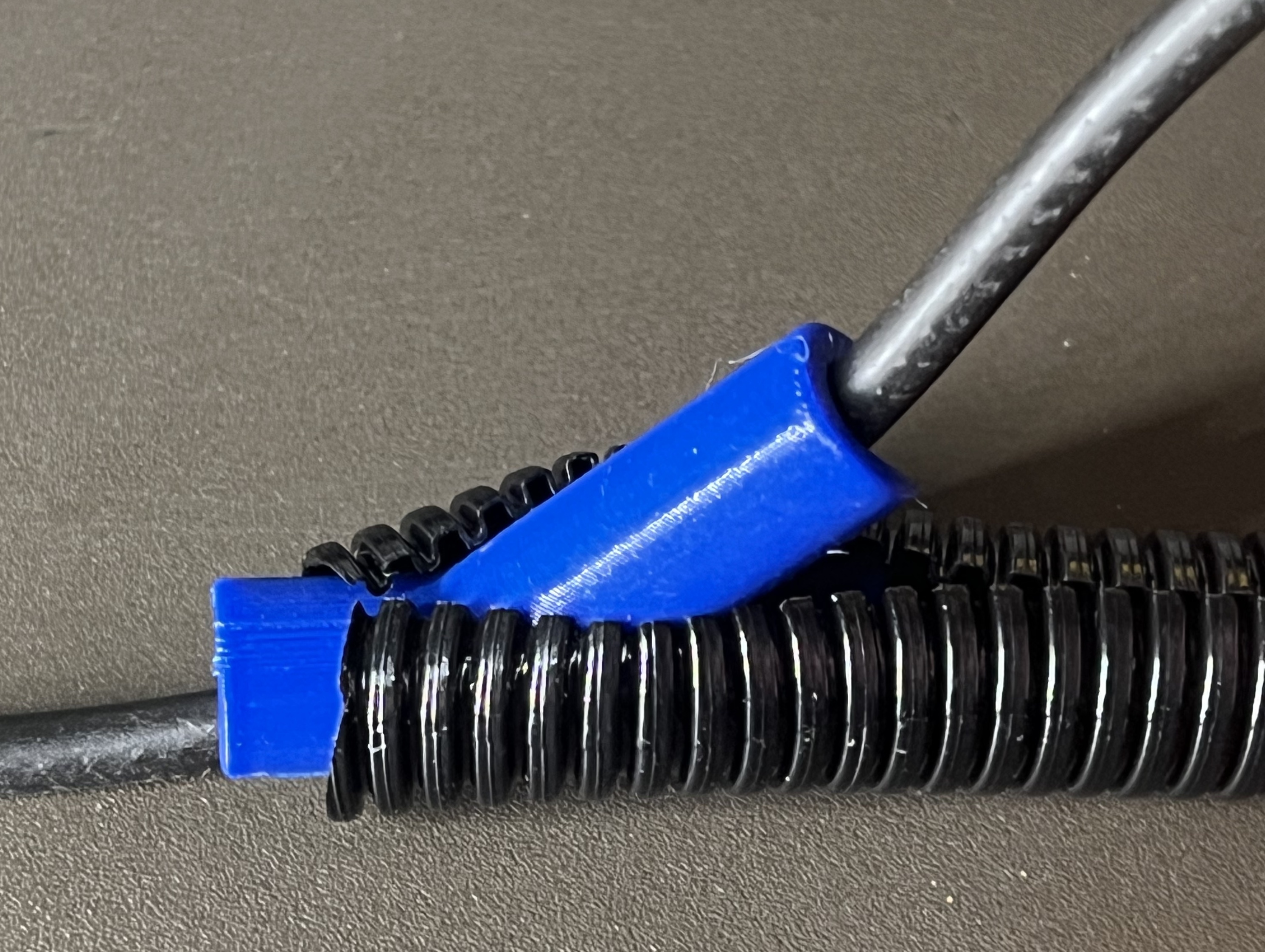 Cable insertion tool for split convoluted tube
